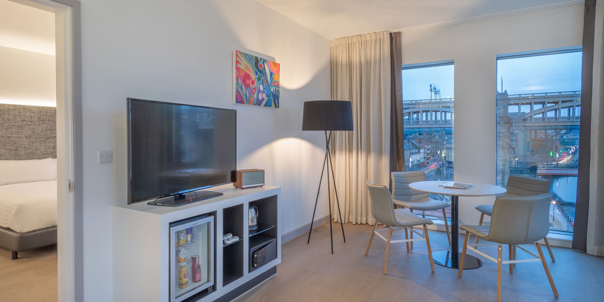 a room with a tv and a table