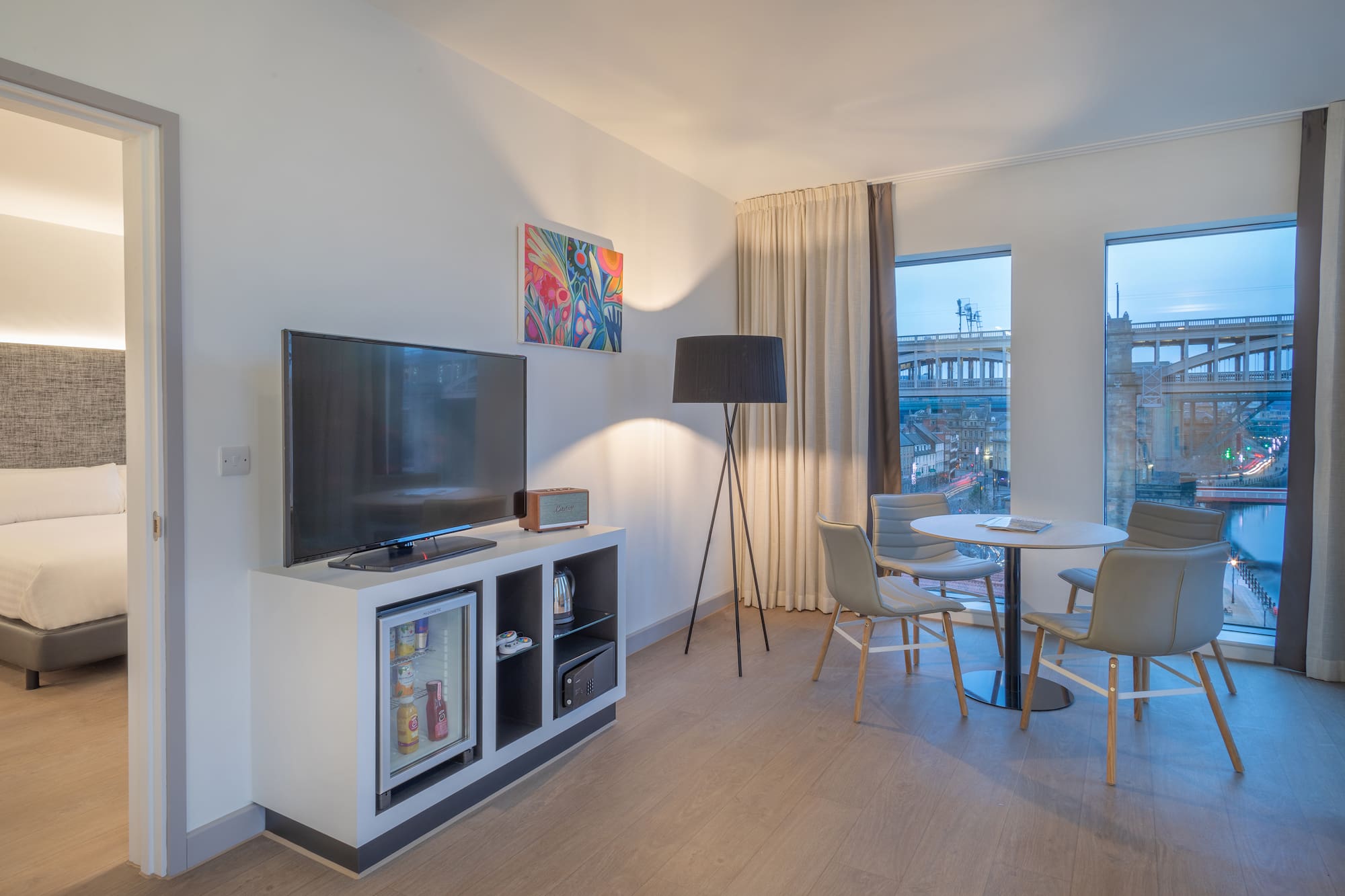 a room with a tv and a table