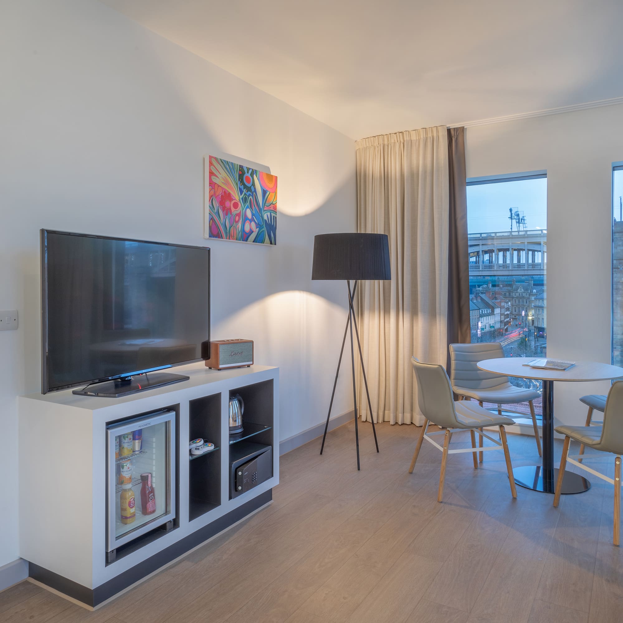 a room with a tv and a table