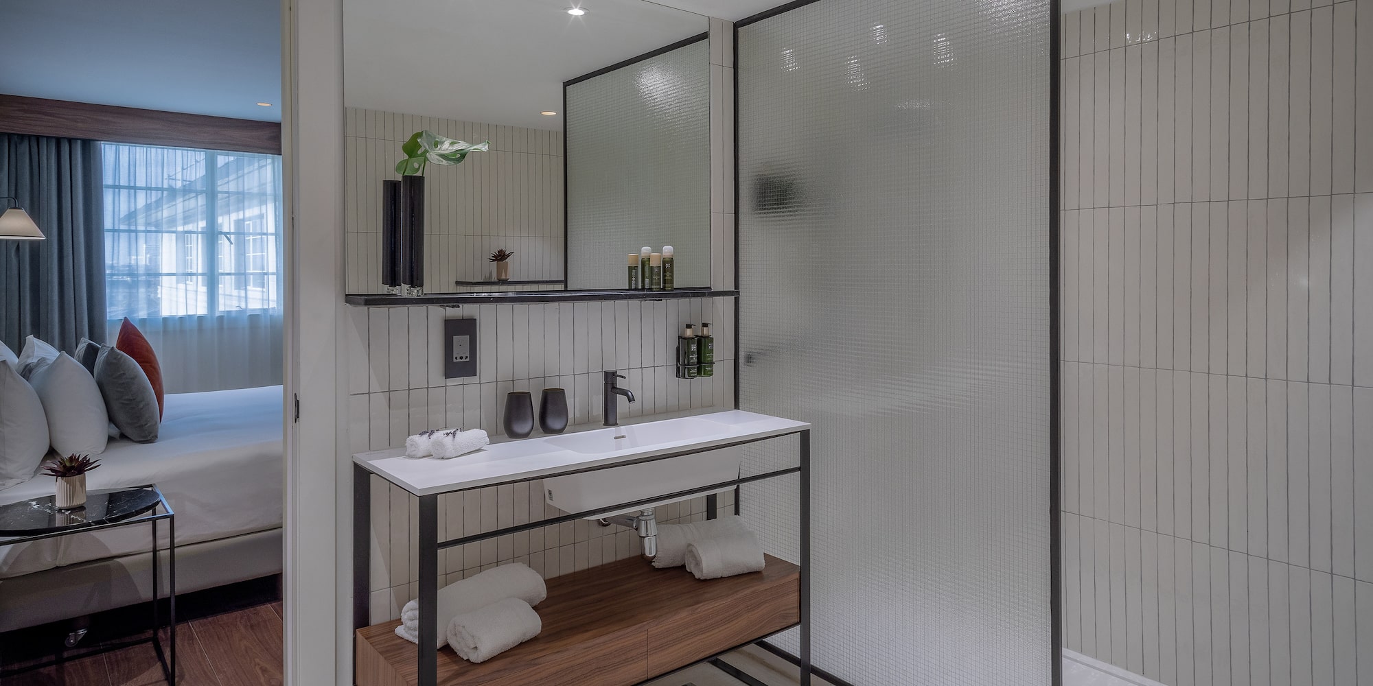 a bathroom with a shower and a sink