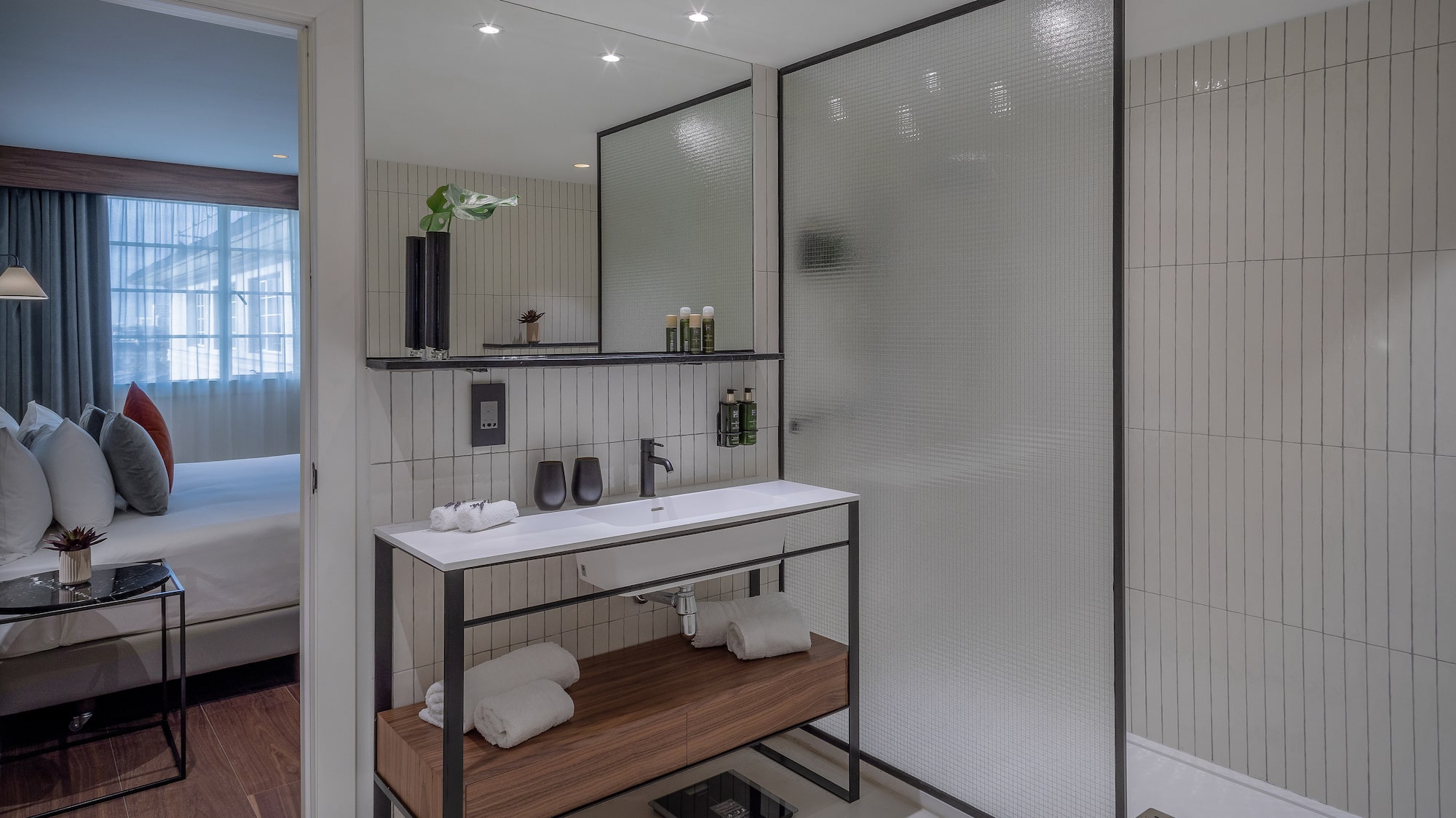 a bathroom with a shower and a sink