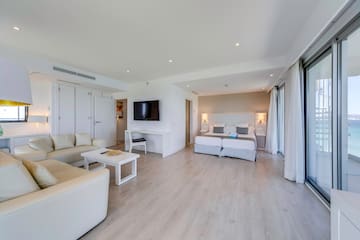 a room with a bed and a tv