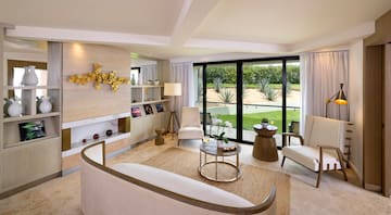 a living room with a couch and a glass door