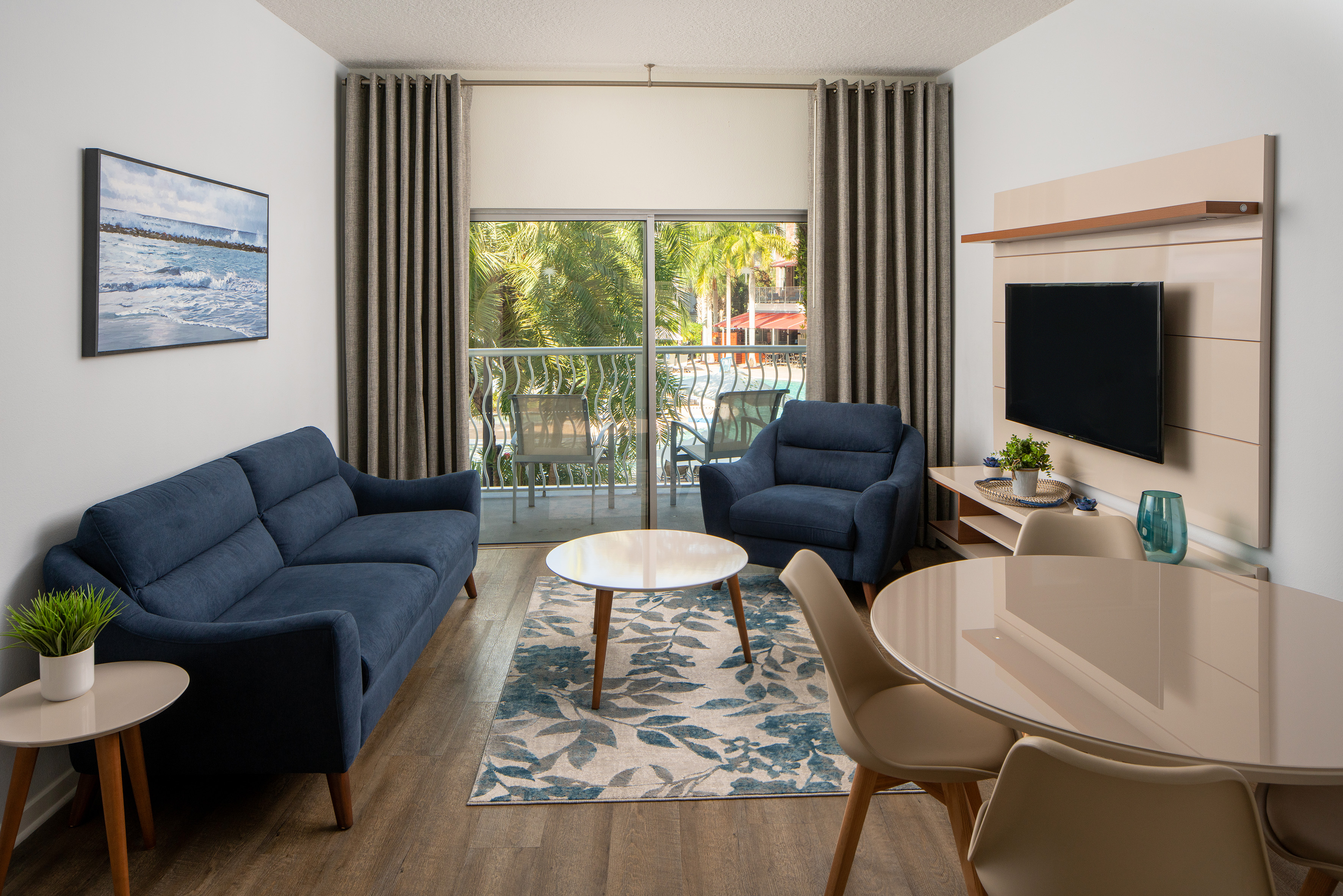 a living room with a table and chairs