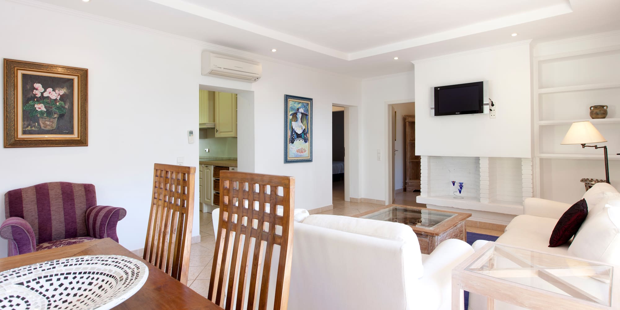 a dining room with a table and chairs