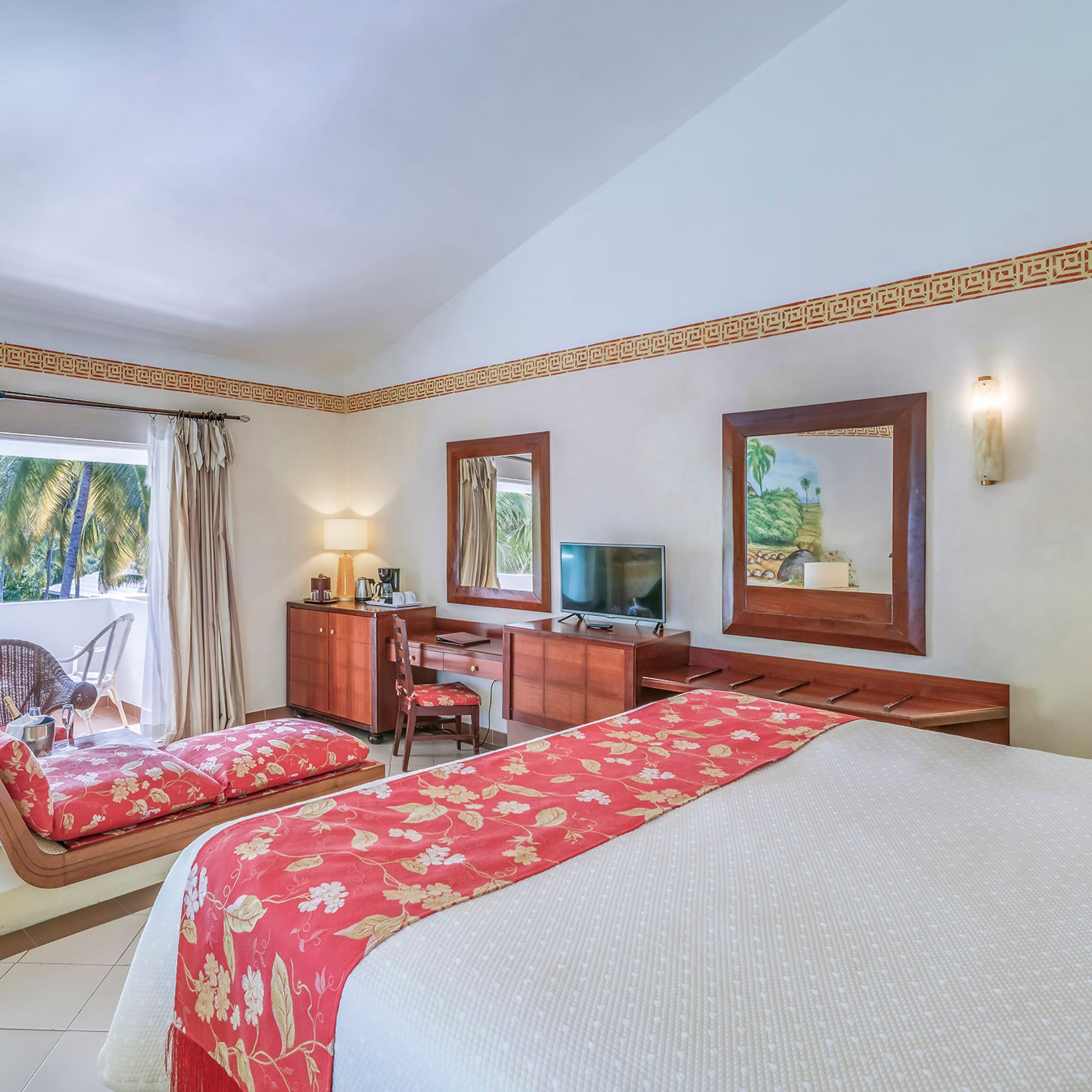 a room with a bed and a television