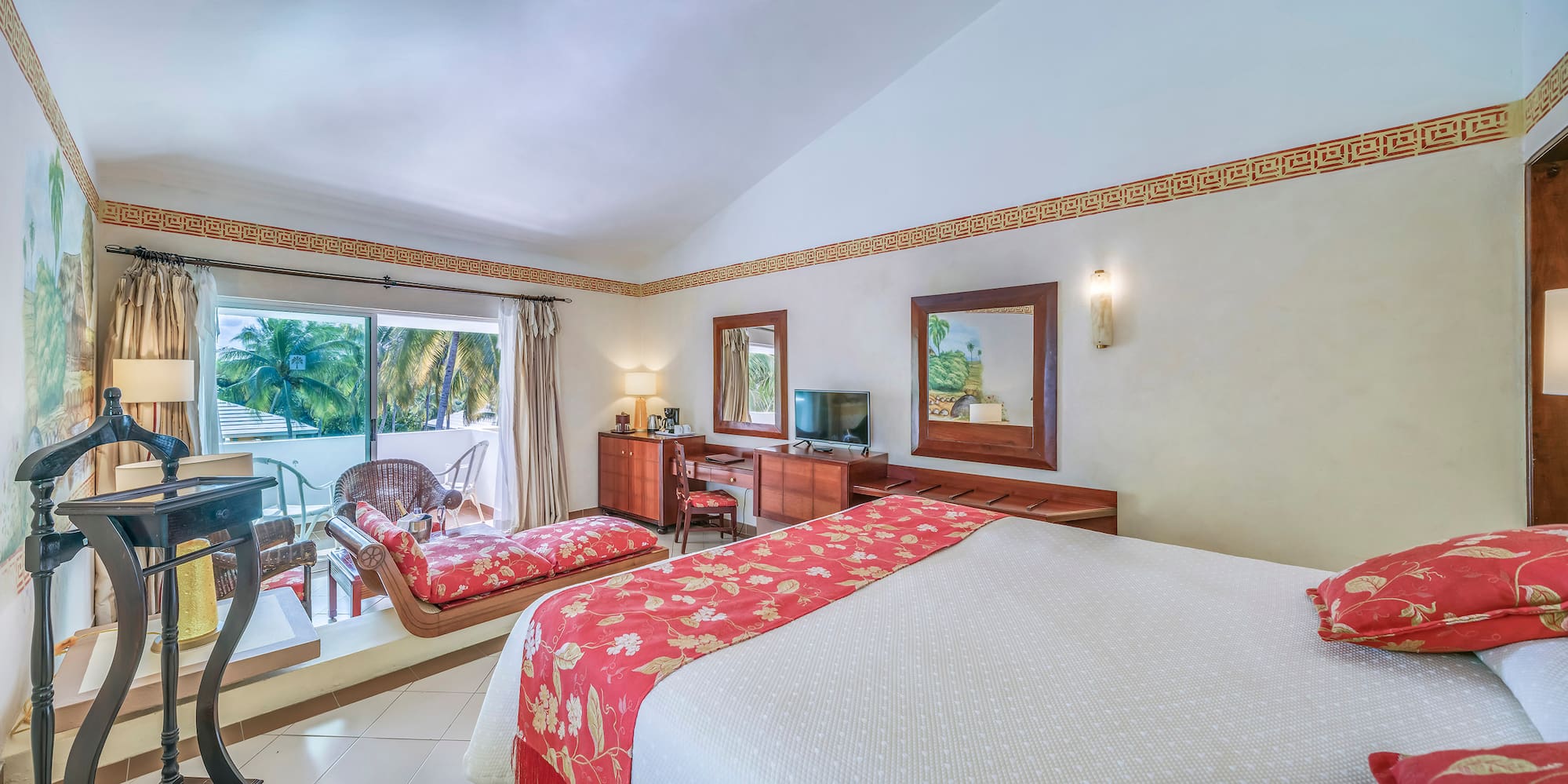 a room with a bed and a television