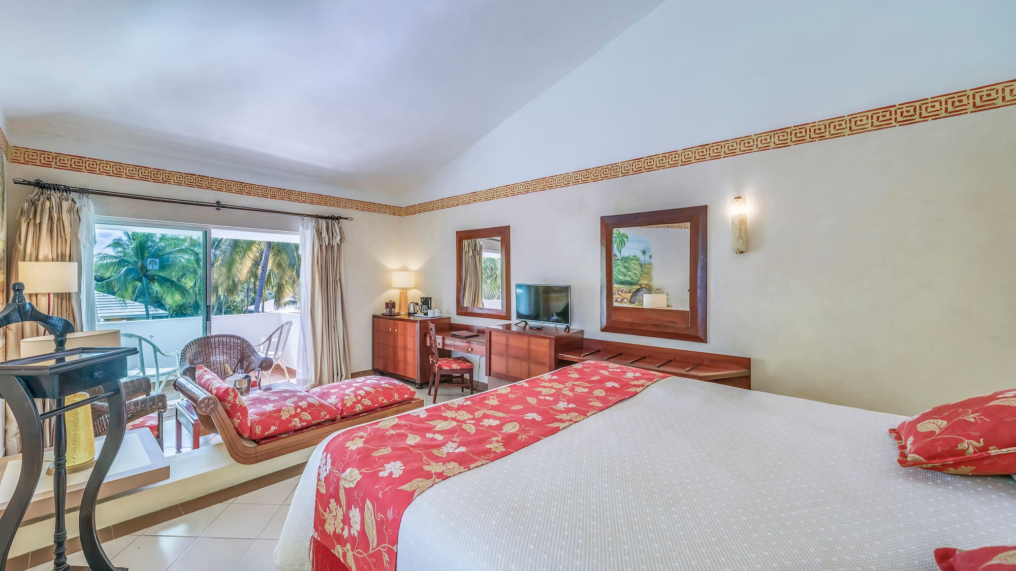 a room with a bed and a television