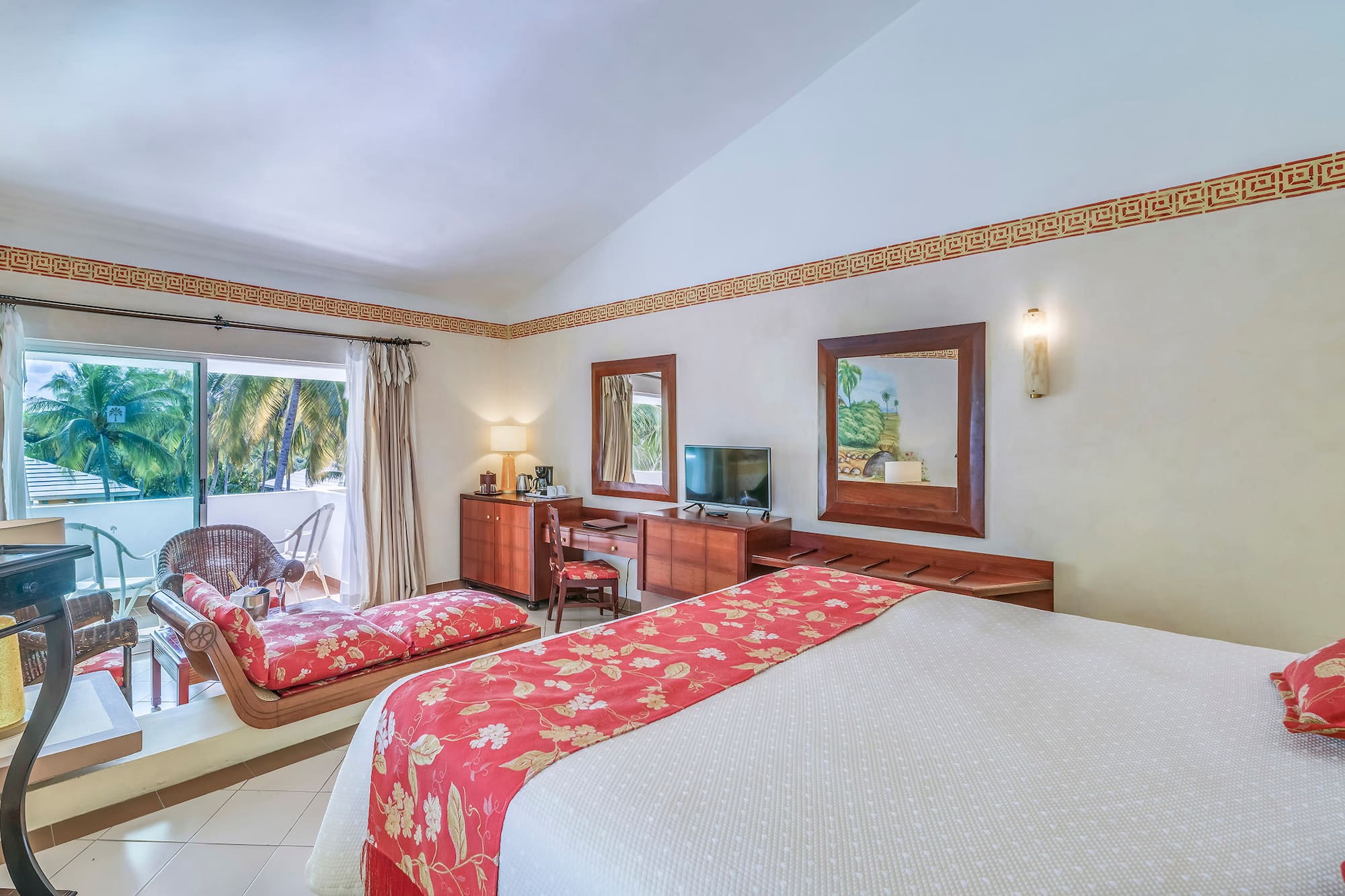 a room with a bed and a television