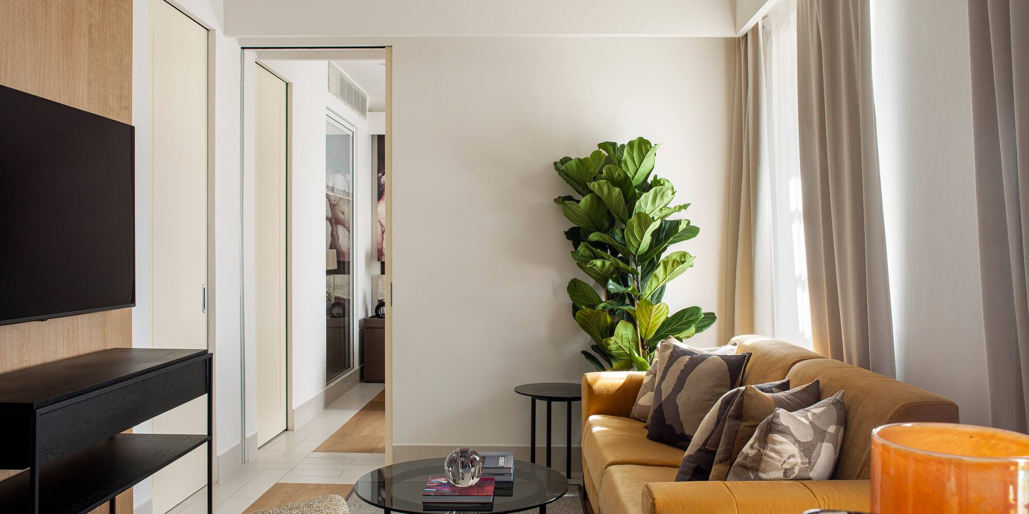 a living room with a couch and a tv