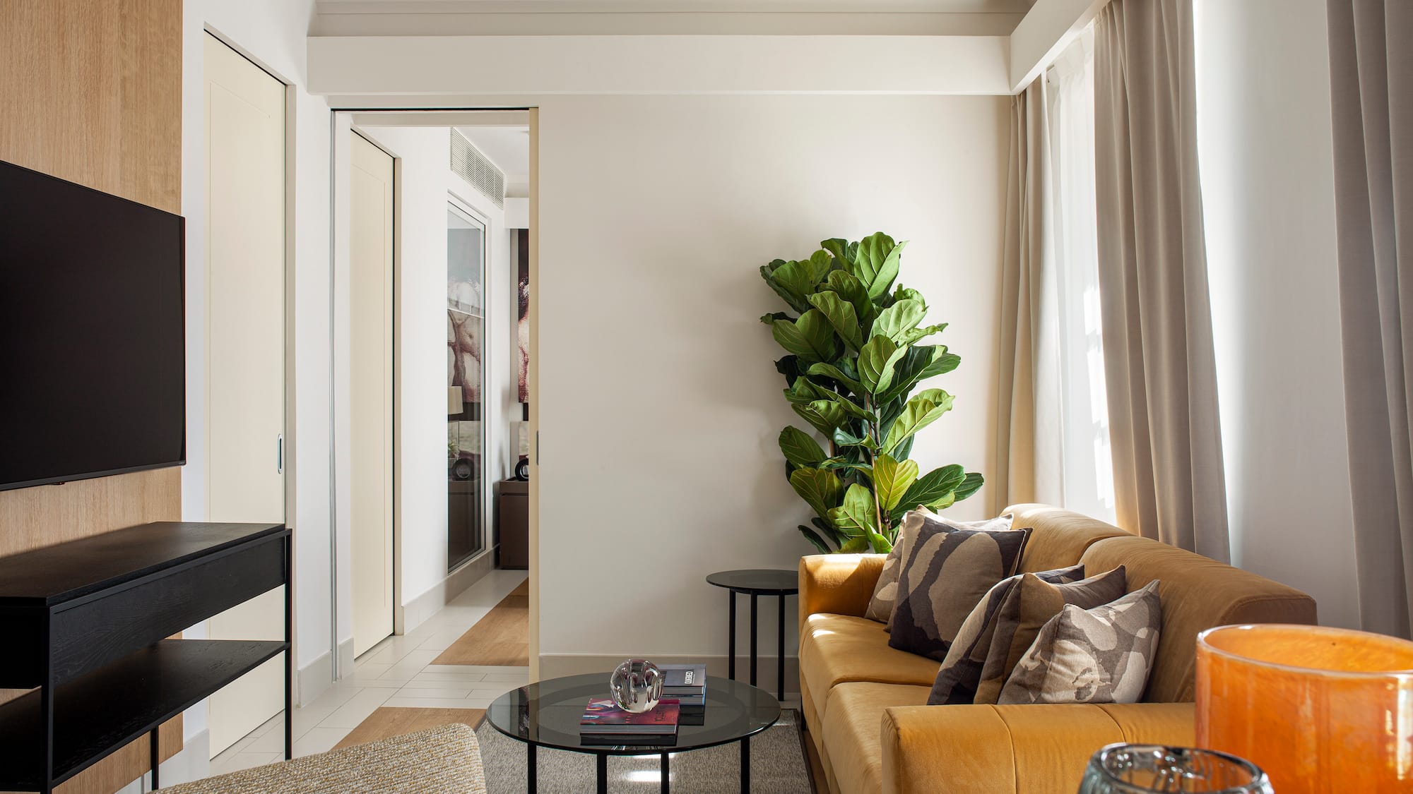 a living room with a couch and a tv