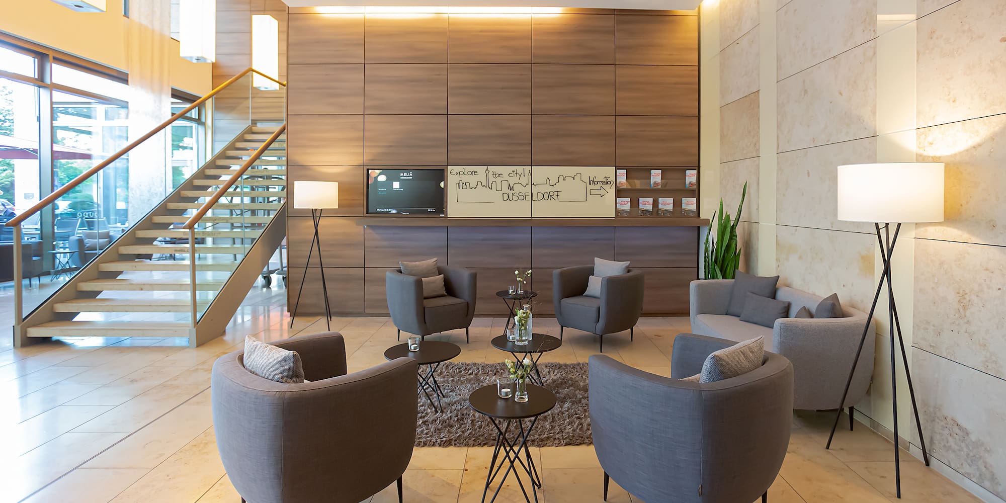 a room with a couch and chairs