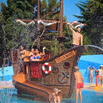 a group of people on a ship in a water park