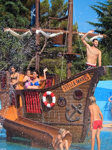 a group of people on a ship in a water park