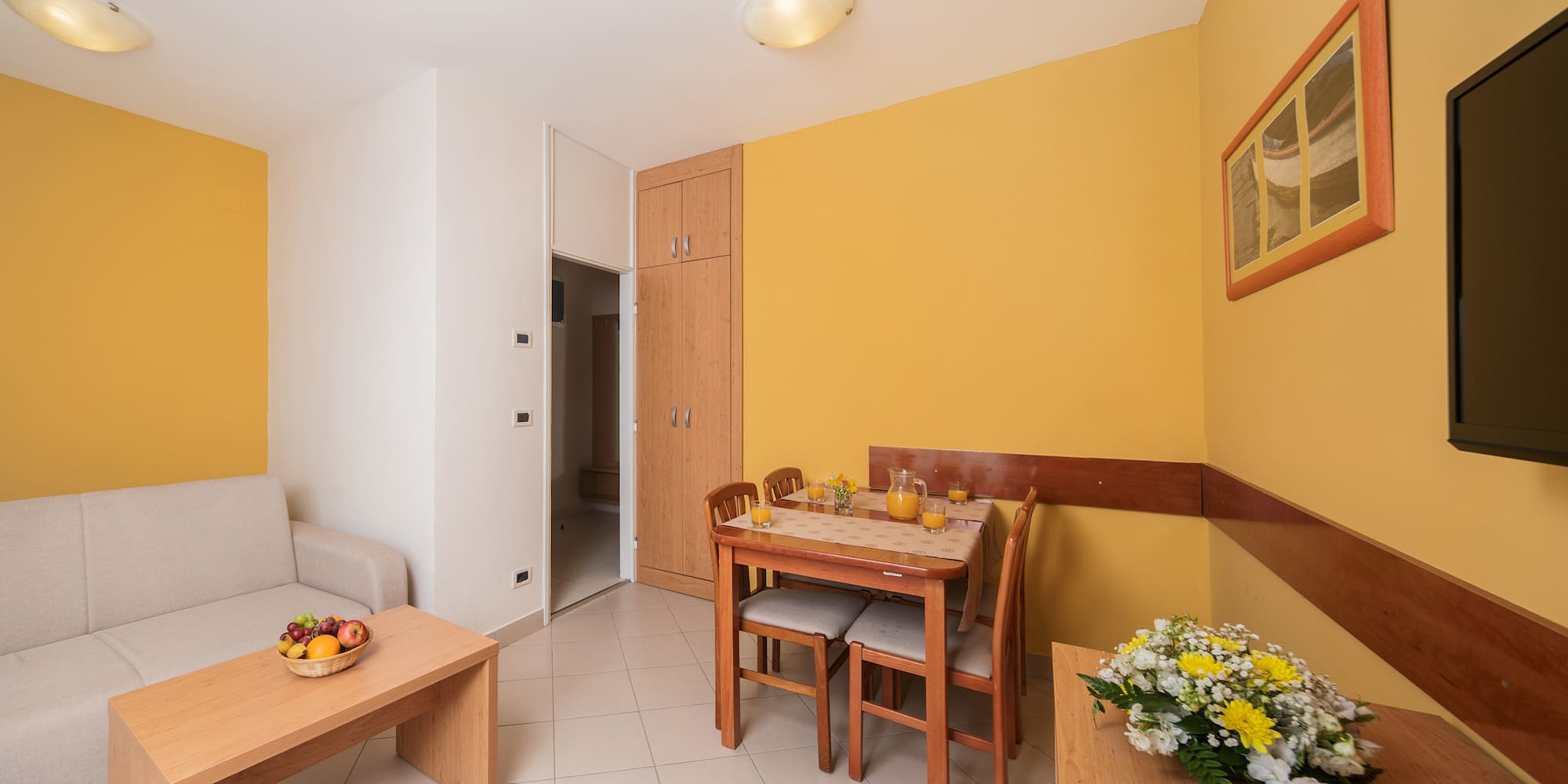 a dining table and chairs in a room