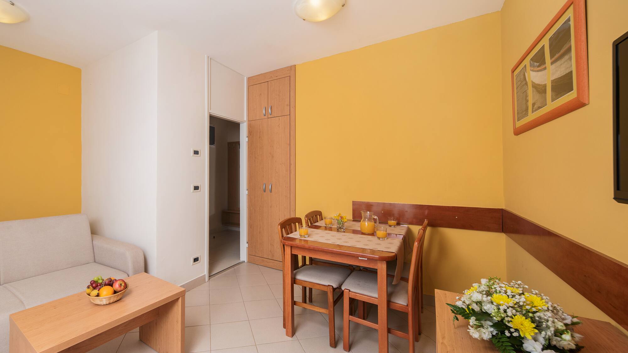 a dining table and chairs in a room