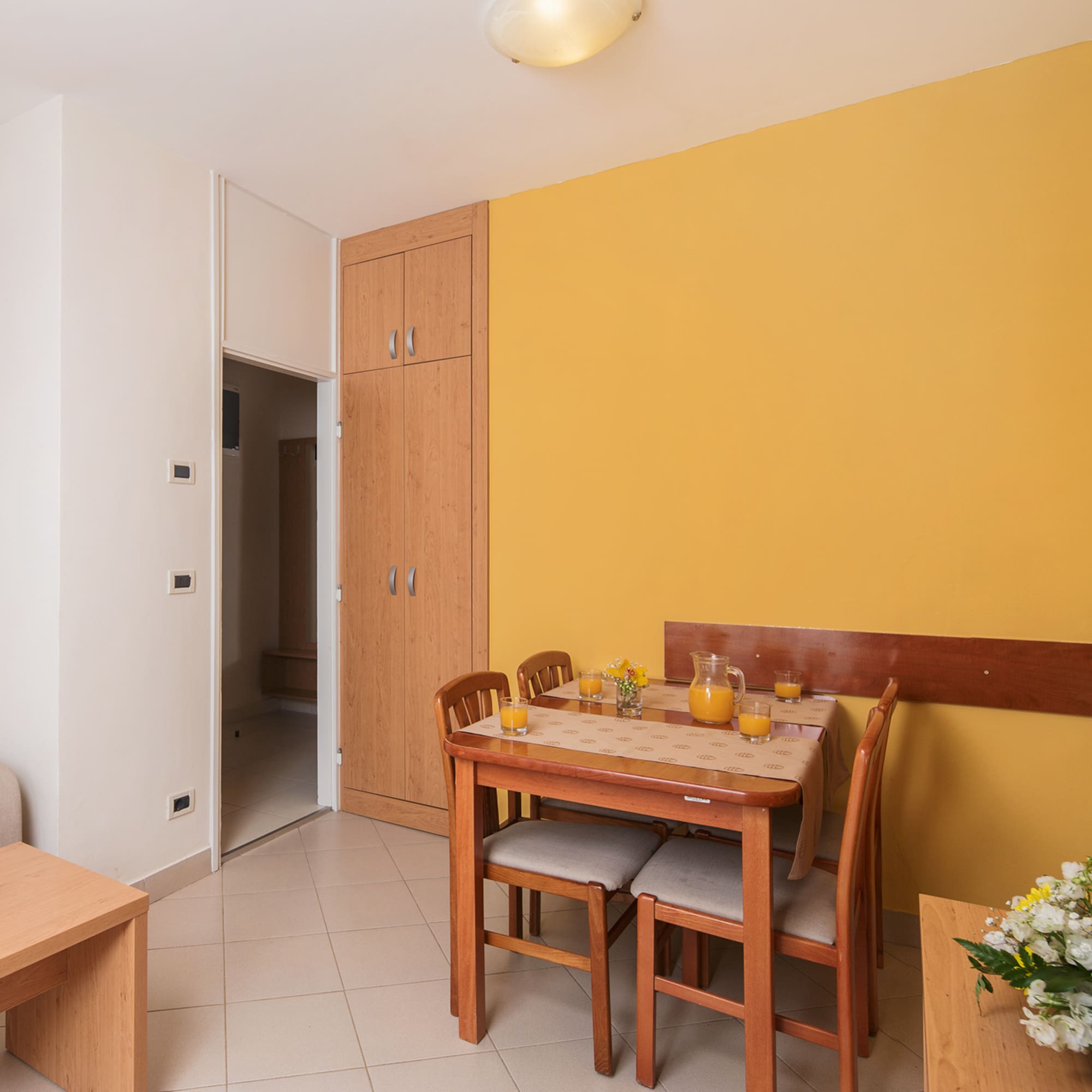 a dining table and chairs in a room