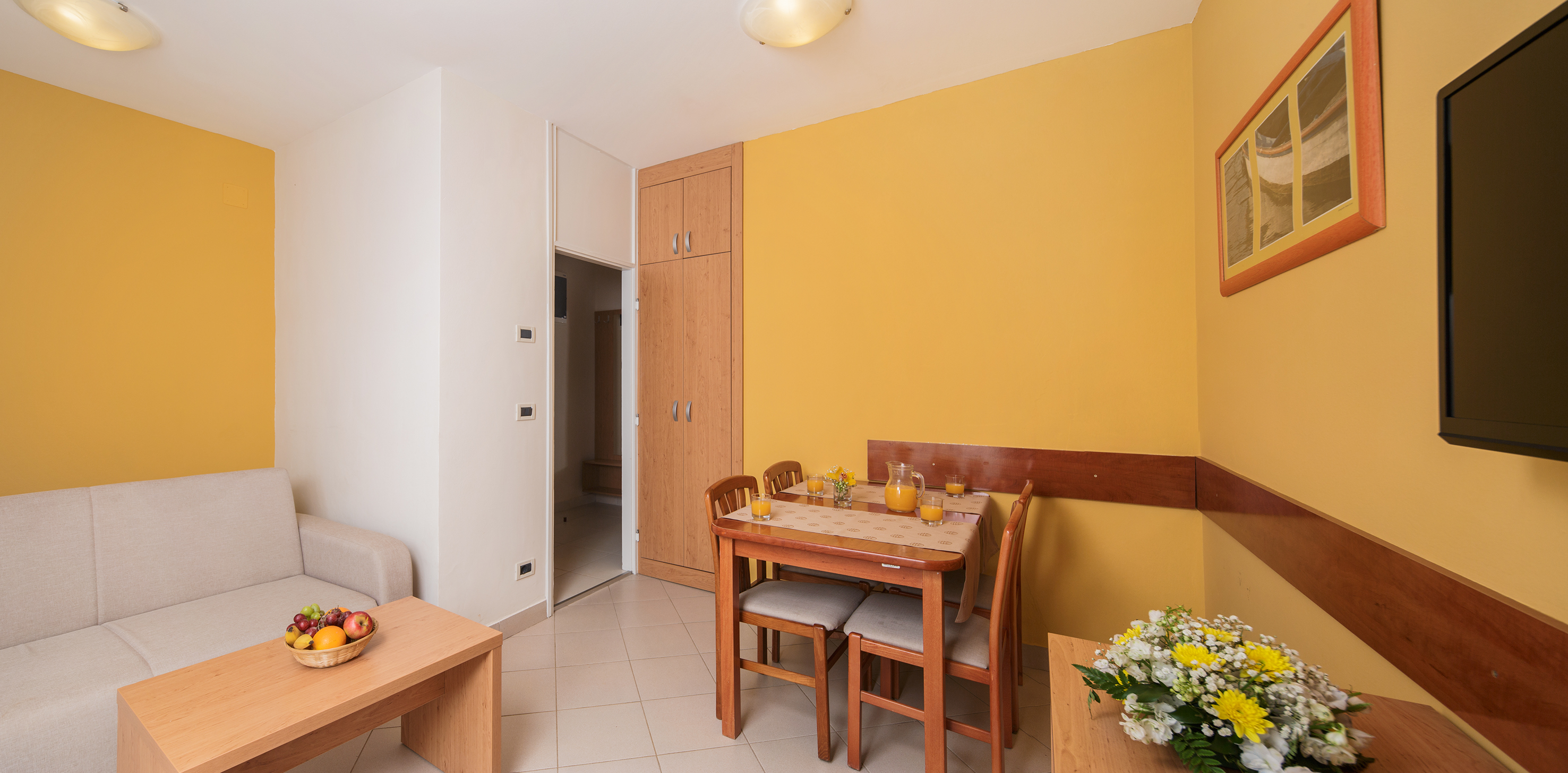 a dining table and chairs in a room