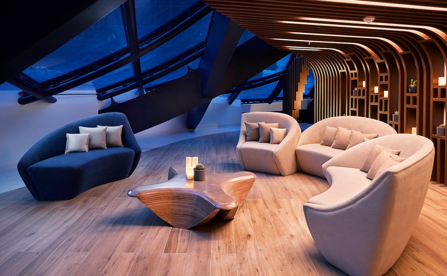 a room with a round table and chairs