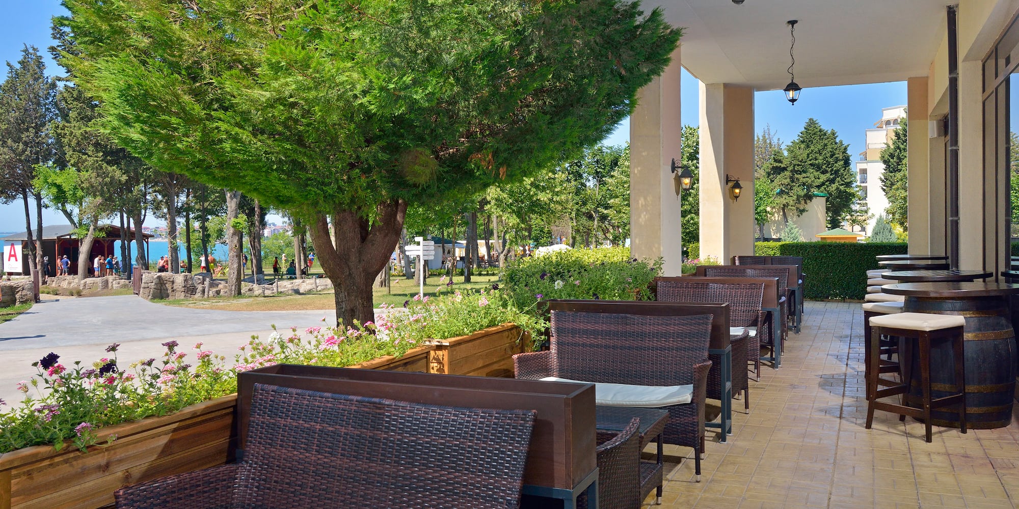 a row of chairs and tables on a patio