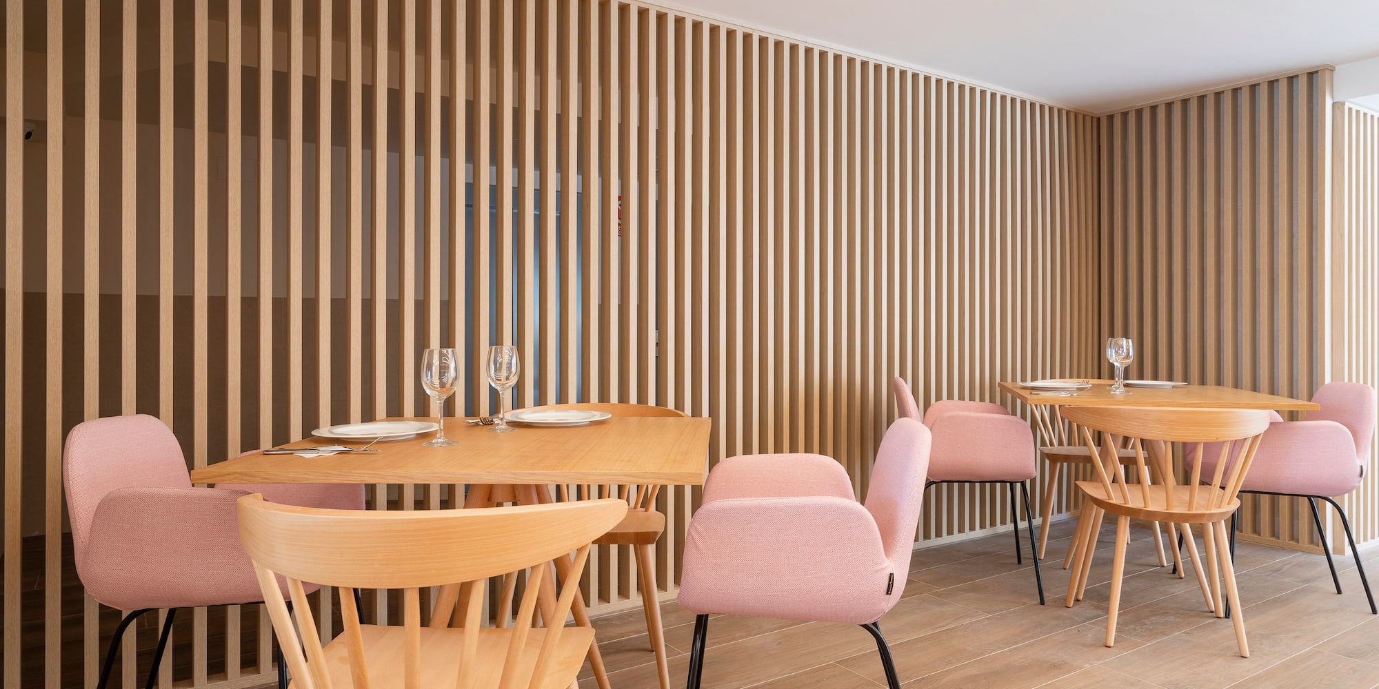 a room with wooden tables and chairs