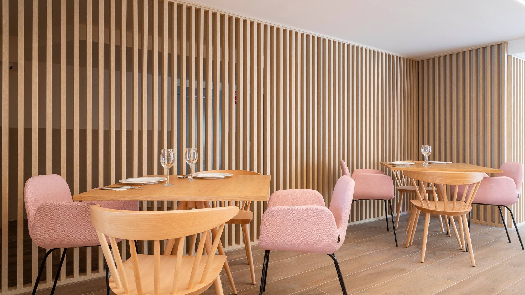 a room with wooden tables and chairs