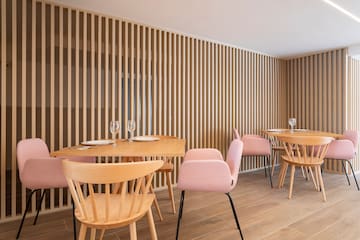 a room with wooden tables and chairs