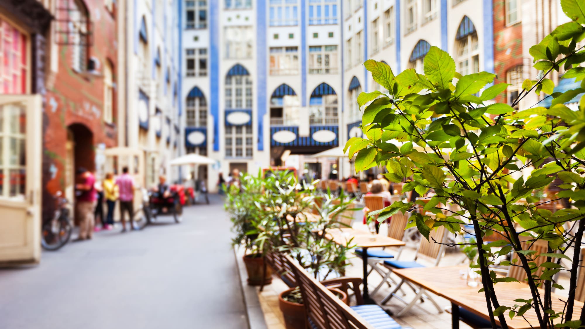 a group of people walking in a city