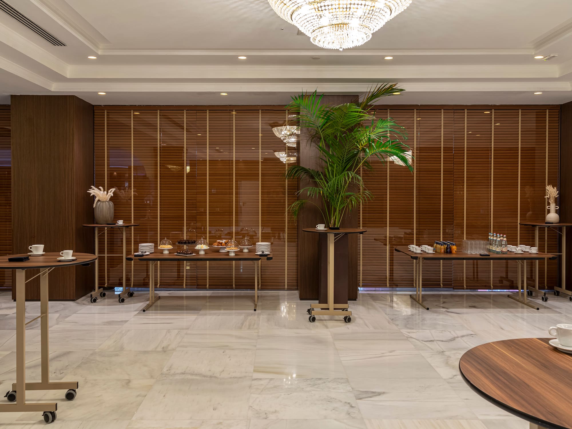 a room with tables and plants