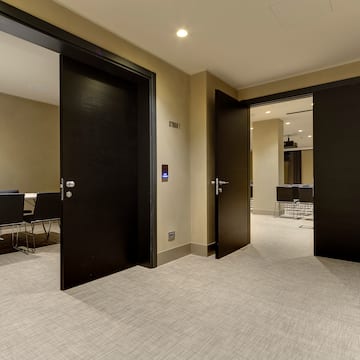a room with black doors and carpet