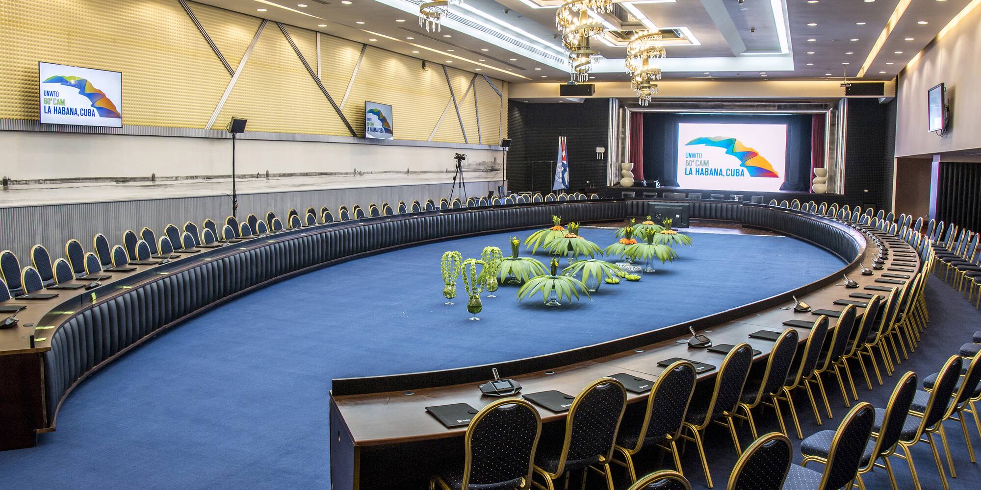 a round room with a round table and chairs