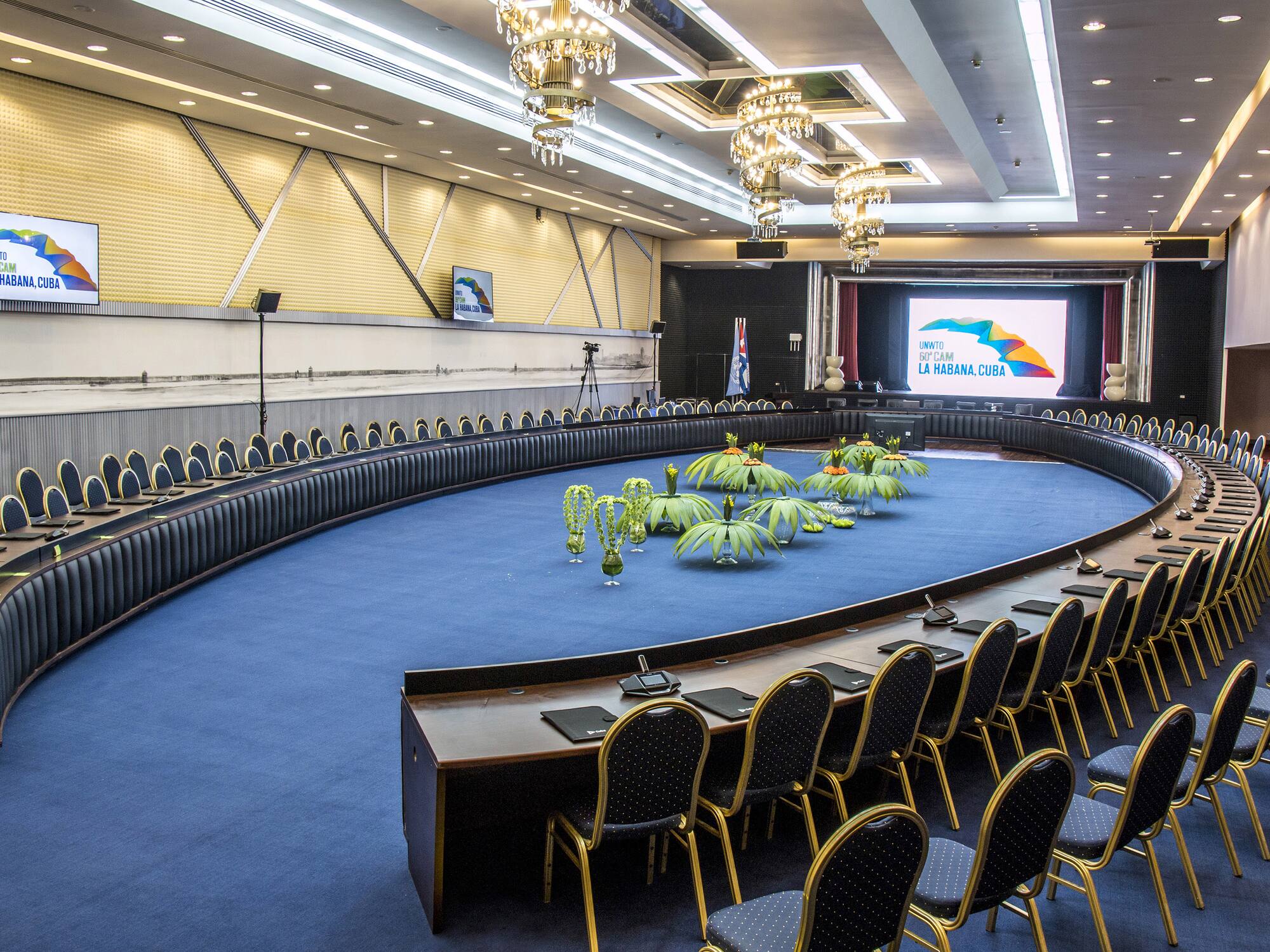 a round room with a round table and chairs