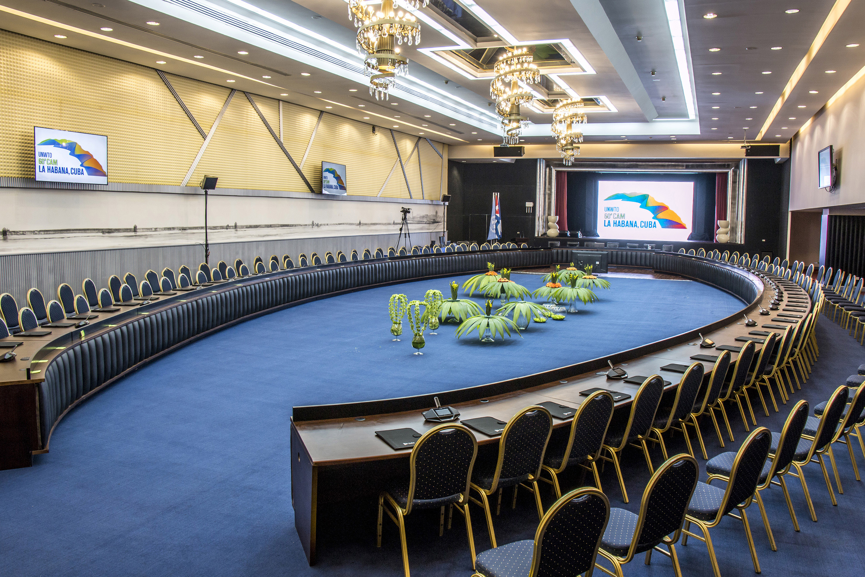 a round room with a round table and chairs