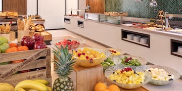 a buffet with fruit in bowls