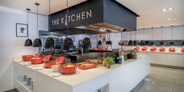 a kitchen with many dishes on the counter