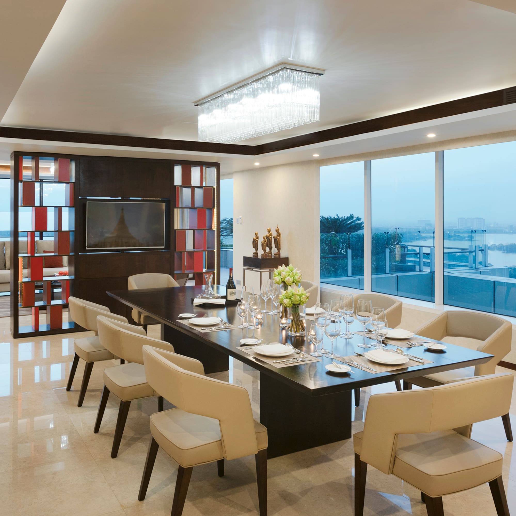 a dining room with a table and chairs