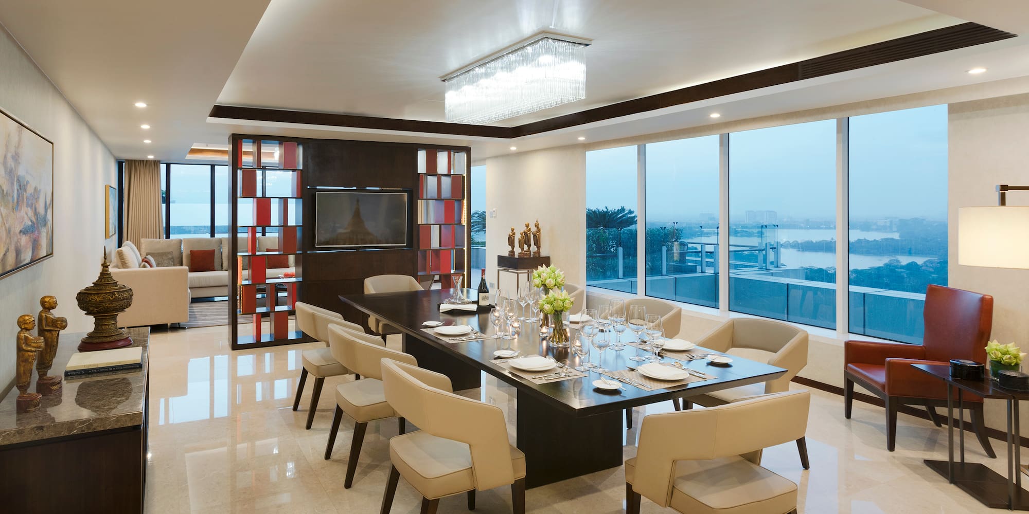 a dining room with a table and chairs