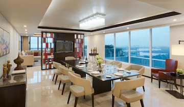 a dining room with a table and chairs