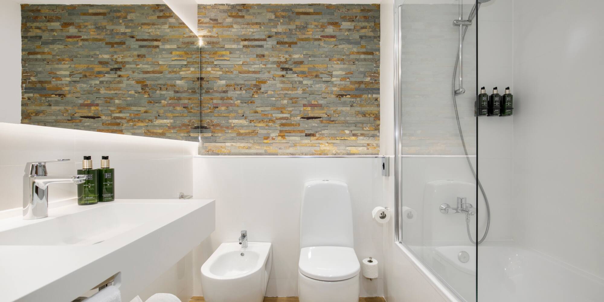 a bathroom with a shower and toilet