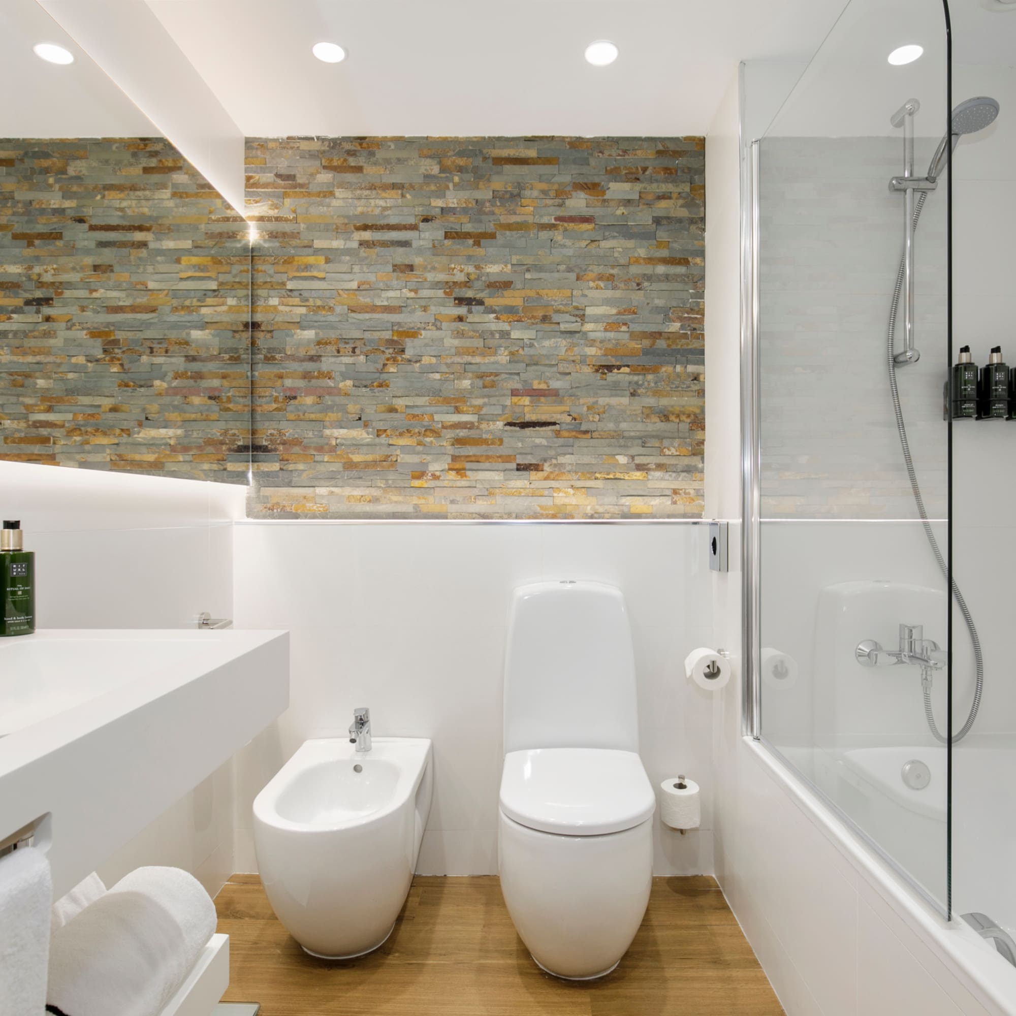 a bathroom with a shower and toilet