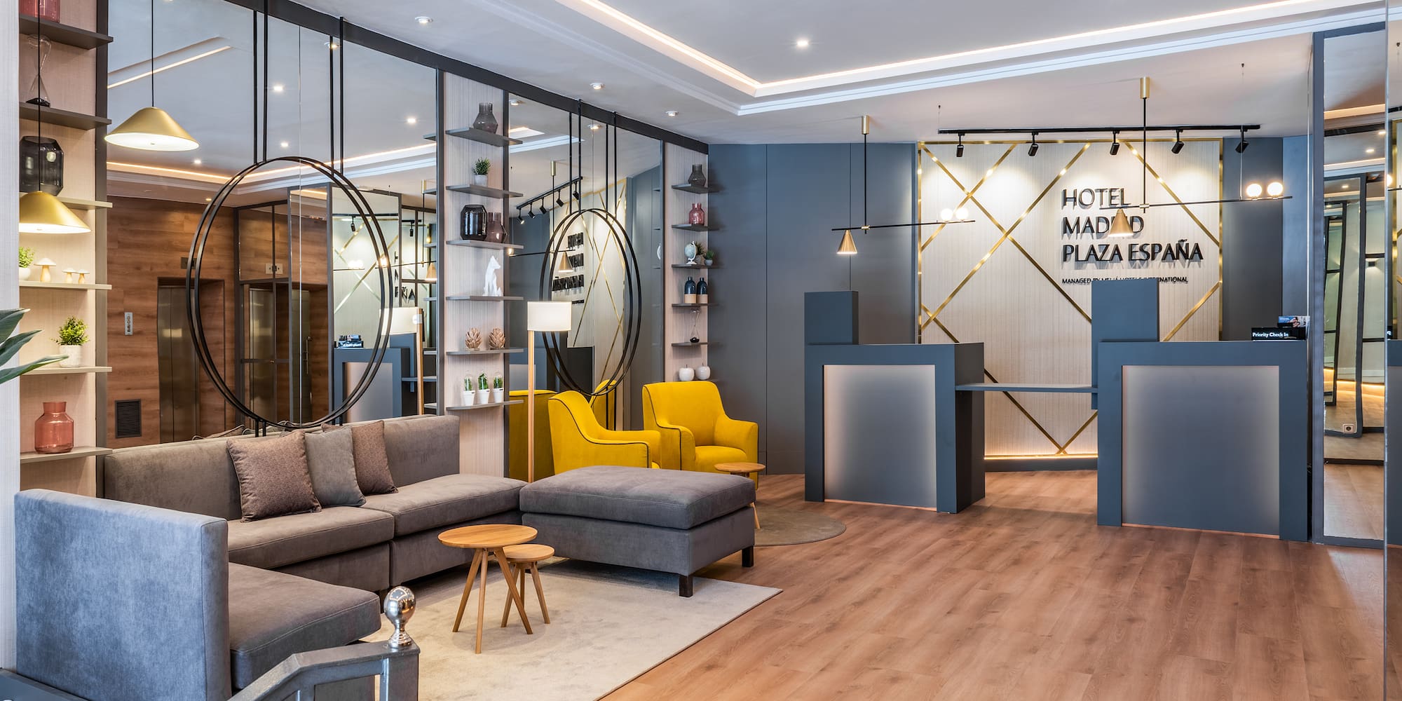 a room with a reception desk and couches