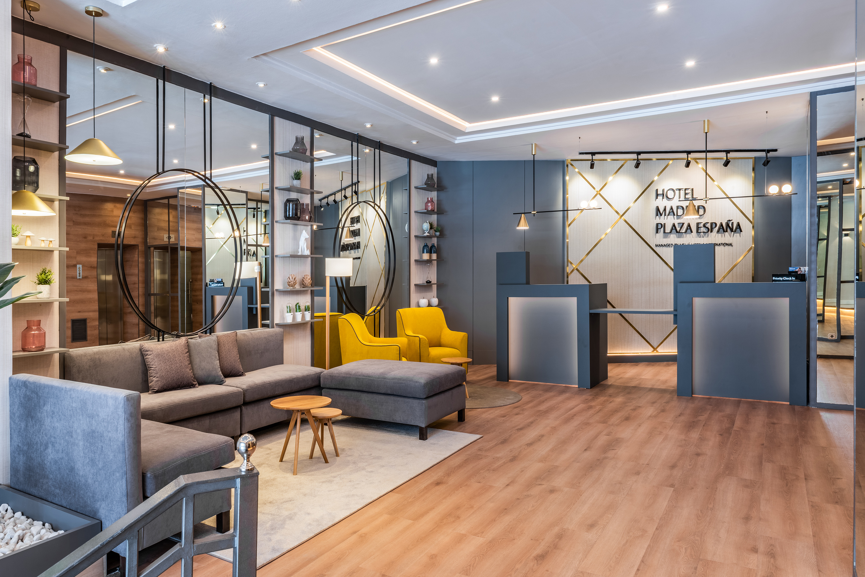 a room with a reception desk and couches