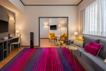 a living room with a couch and a rug