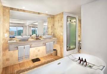 a bathroom with a tub and sink