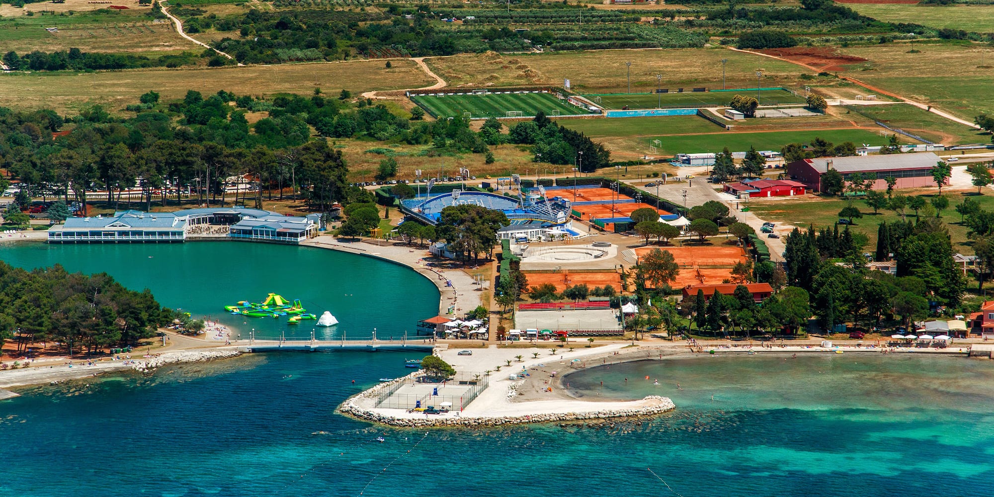 a aerial view of a body of water with a body of water and a city
