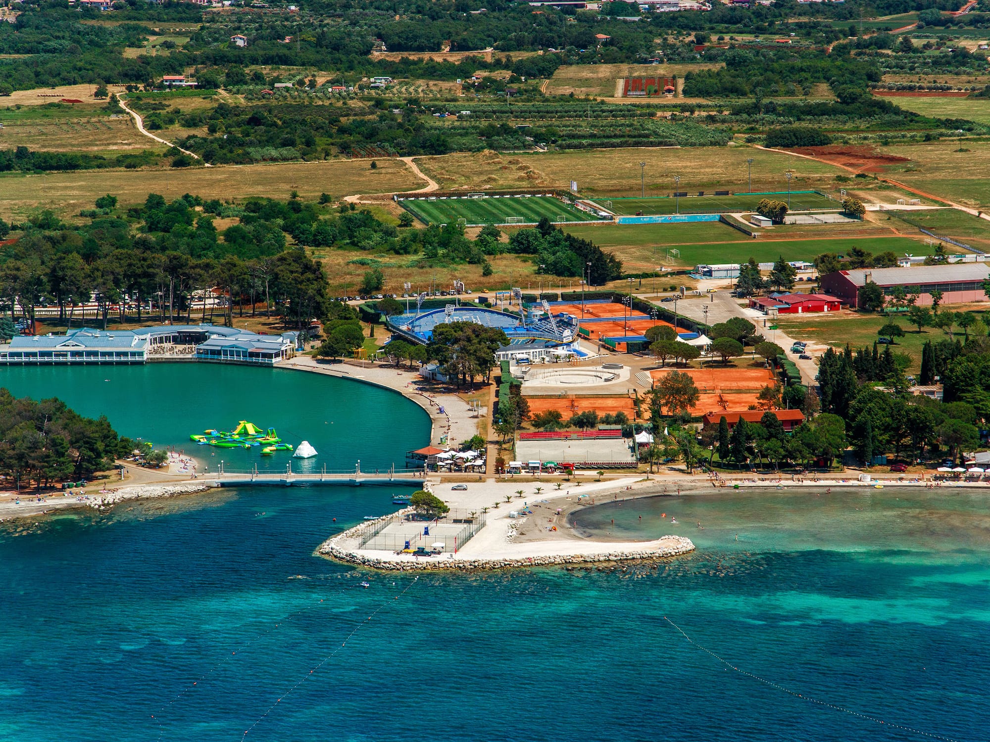 a aerial view of a body of water with a body of water and a city