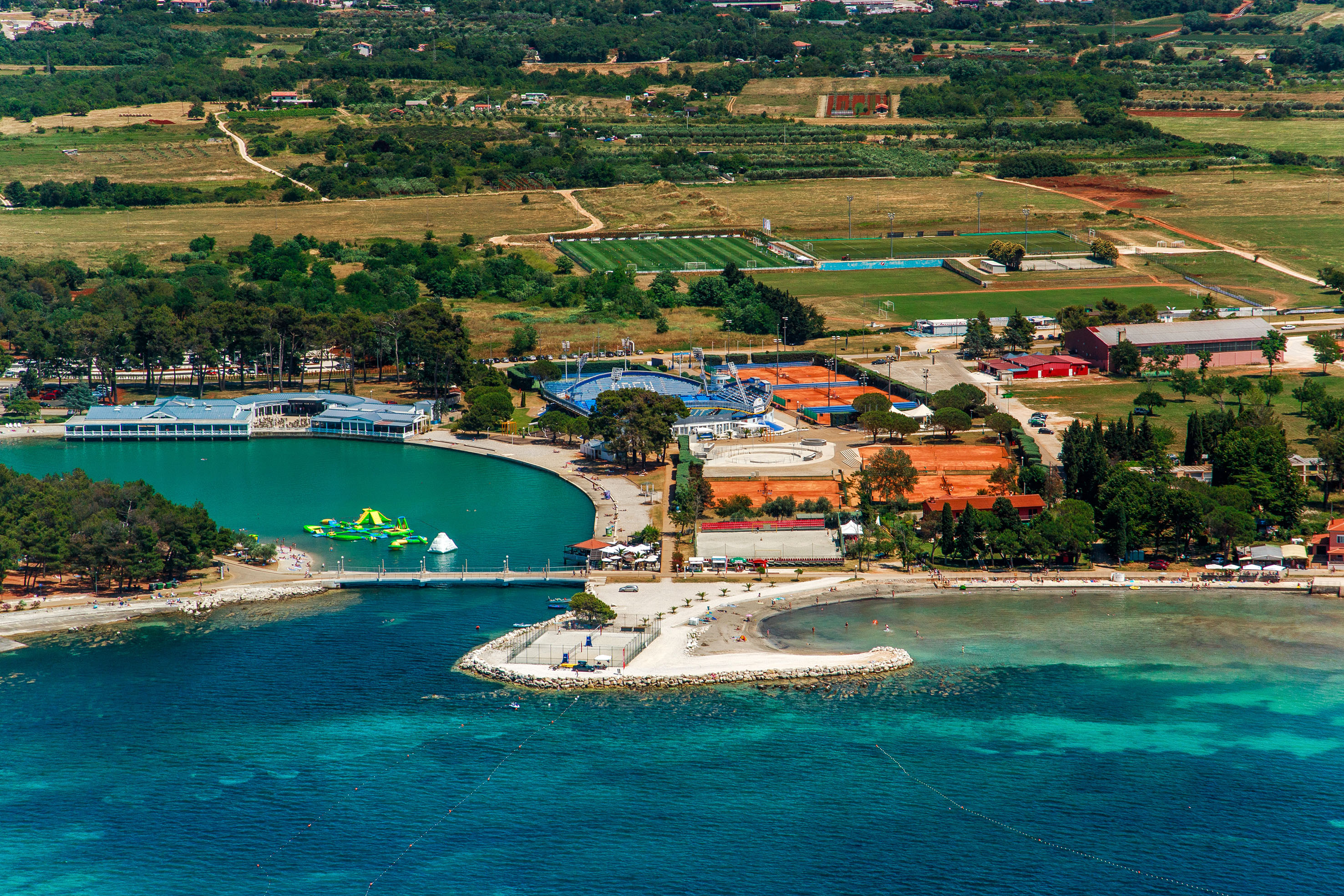 a aerial view of a body of water with a body of water and a city