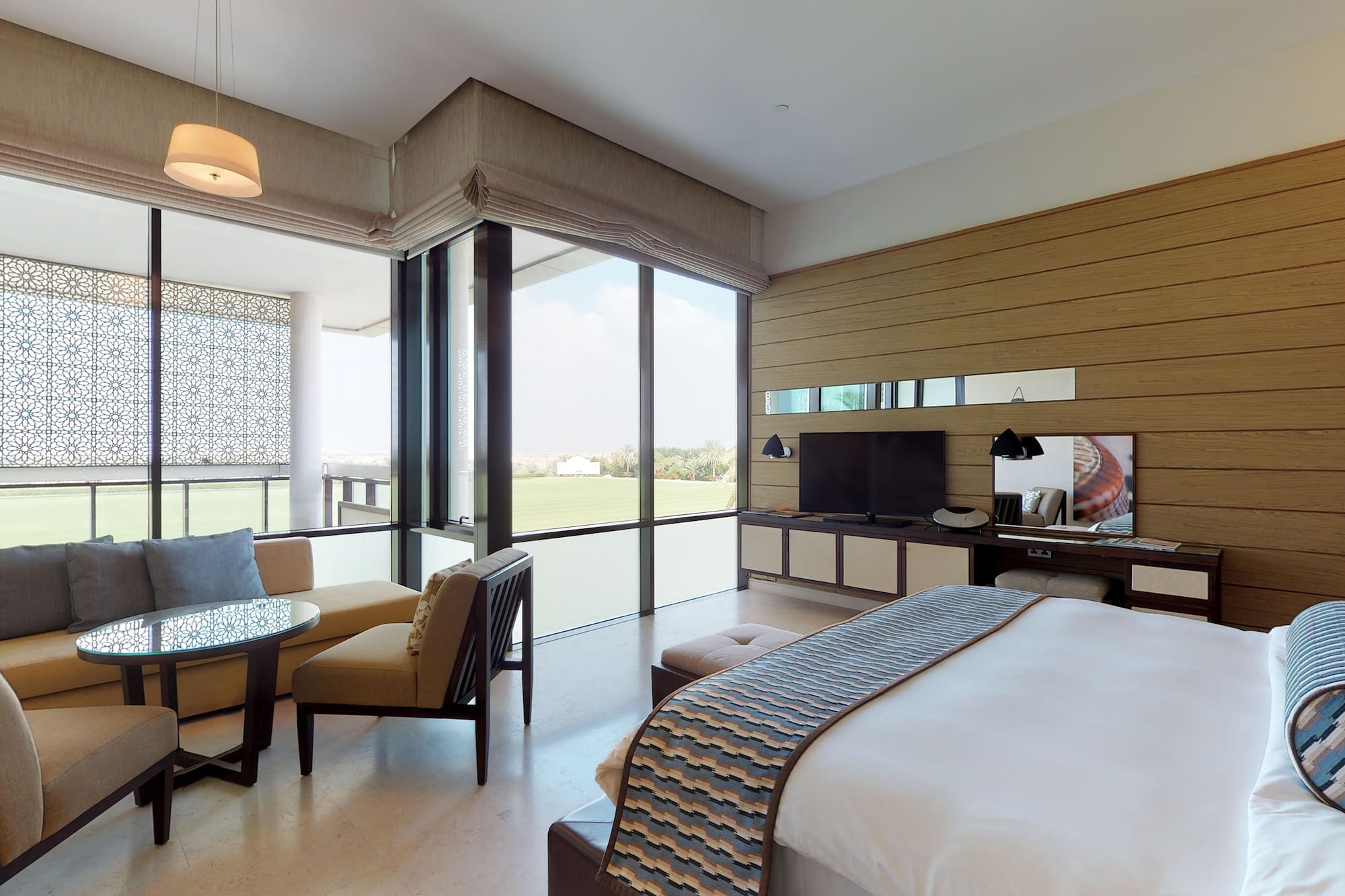 a room with a bed and a television