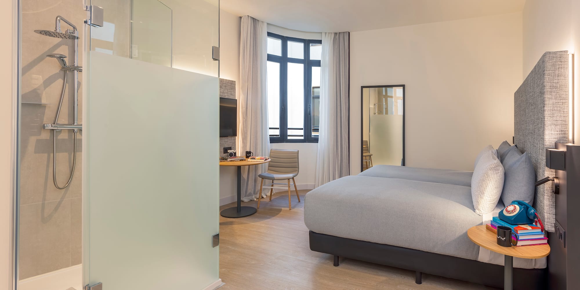 a bedroom with a bed and a desk