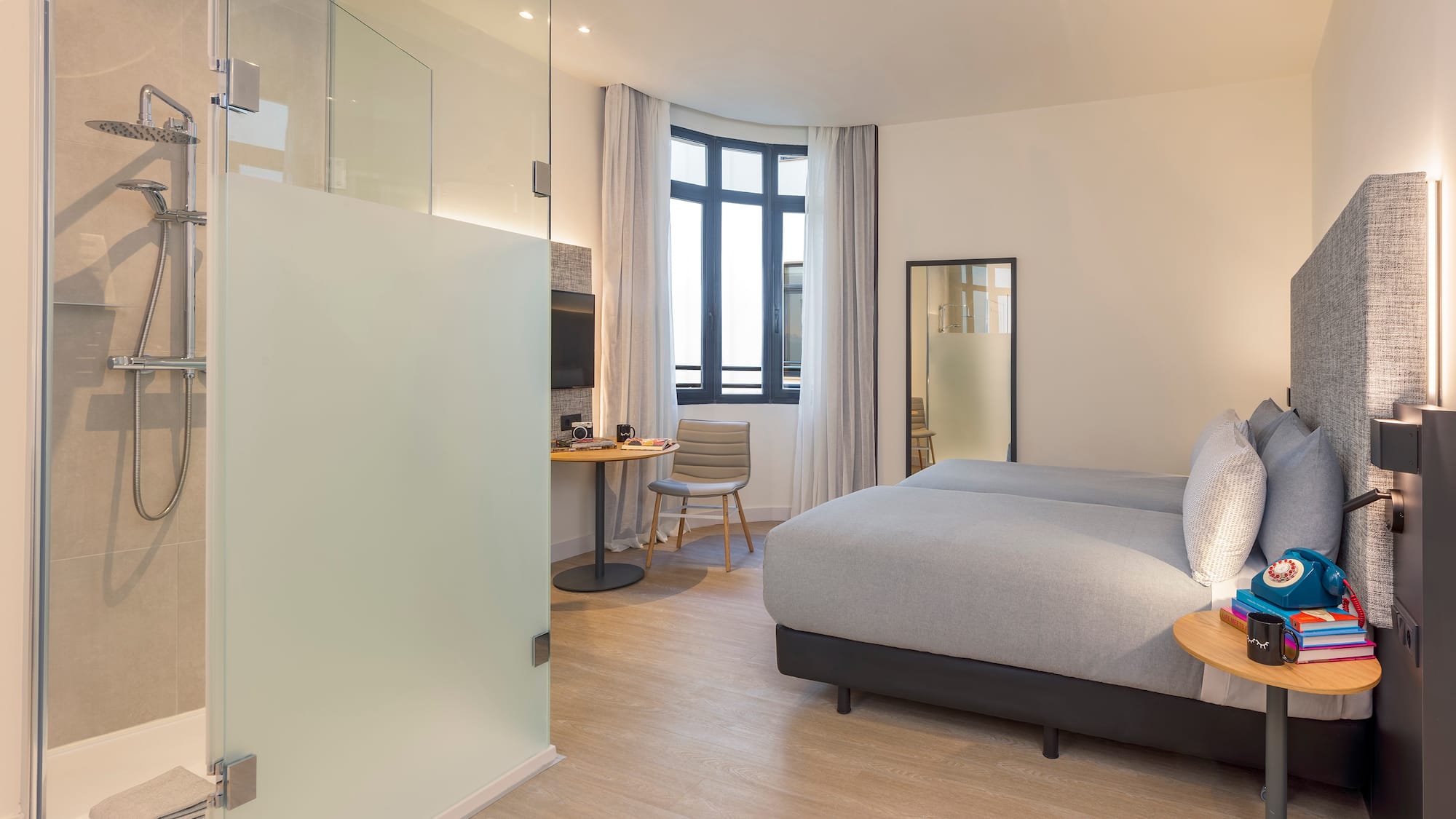 a bedroom with a bed and a desk